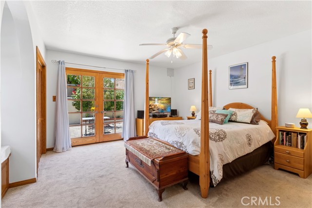 Primary Bedroom with French Doors to private patio.