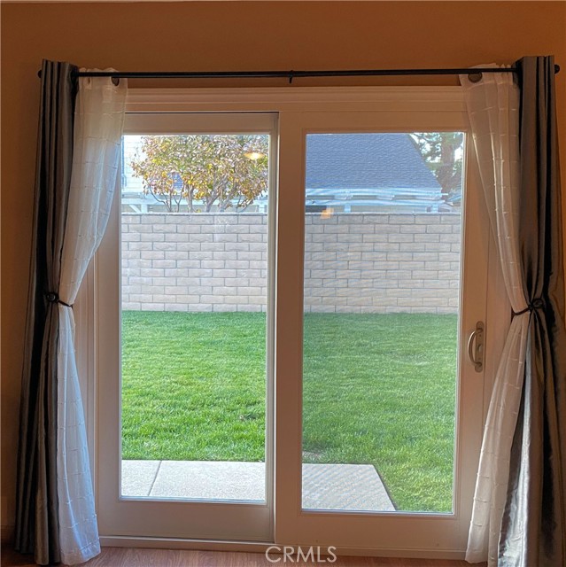 New sliding door opens to lush green grass in backyard