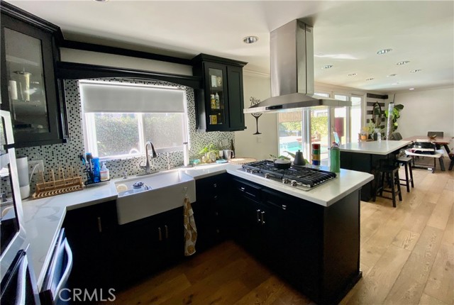 Top of the line sleek black cabinets with custom built stone countertops.