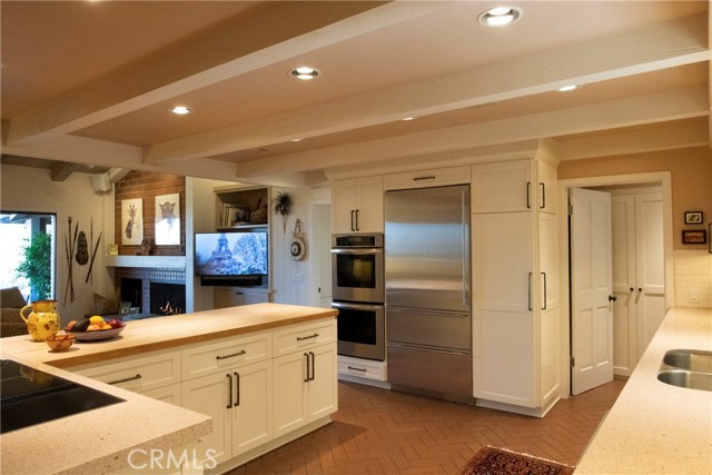 View of the Kitchen an it's connection tp the Family Room.Laundry and Second Bedroom are adjacent.