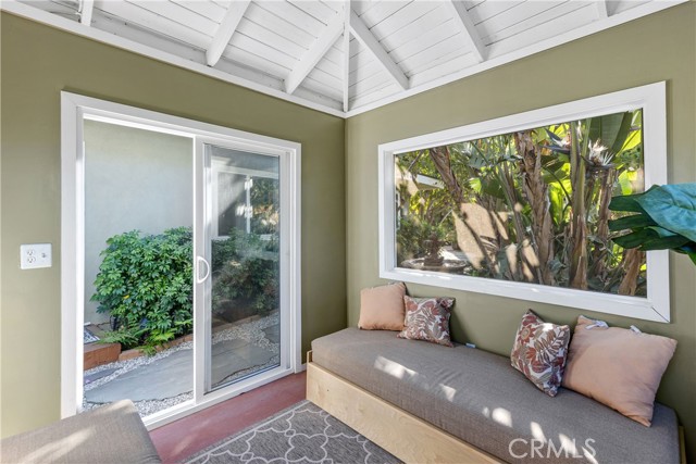 Nestled in the backyard is an intimate and versatile screened-in patio to enjoy the outdoor clime in comfort.