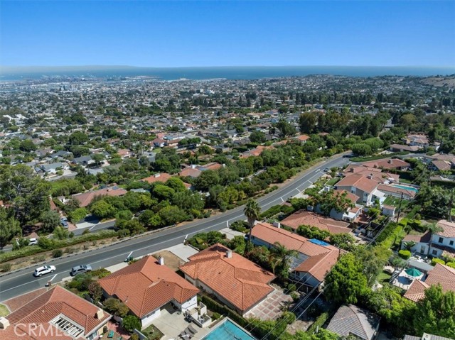 Aerial of home with views to ocean.