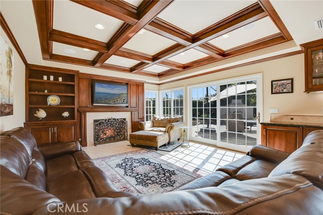 Family room with exit to patio and pool areas