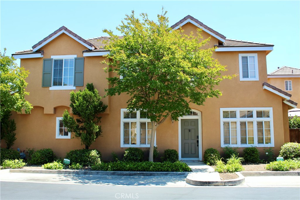 Welcome to your Valencia dream home in the Montevista community! This stunning residence features an open floor plan that seamlessly connects the living spaces, making it perfect for both daily living and entertaining. With three bedrooms and two and half baths, the home boasts upgraded laminate wood flooring, fresh paint throughout, mirrored closet doors in all bedrooms, upstairs laundry, and attached two car garage with additional shelving possibilities. Enjoy cozy evenings by the fireplace with custom mantel in the inviting living room, while meals can be shared in the separate dining area or on the private patio off the kitchen nook. The chef's kitchen is equipped with top-end stainless steel appliances and ample cabinet space including large pantry. The primary bedroom offers a walk in closet plus a secondary closet with beautiful mirrored doors. Upstairs bathrooms include elegant Corian counters, beautiful stone tile flooring with bathtub and shower capabilities, ensuring both functionality and style. One of the lowest HOA combos in Valencia, close proximity to schools, shopping, paseos, and freeways.