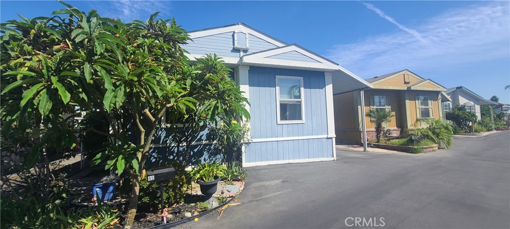 8111 Stanford Avenue 45 Stanton, California Welcome Home! Lovely 3 bedroom, 2 bathroom home in a QUIET All-Age community. Gorgeous garden featuring Plumeria trees line the front entry walk-way, provides shade to the home and wonderful scent when in bloom! Enjoy plenty of natural light in the Living Room with the Dormer Window, keep the home cool and private with upgraded vinyl blinds throughout the home so no need to worry about tangling up the blinds drawstrings! Enjoy your Galley-style Kitchen with Breakfast Bar top Seating, or use as an office area. Natural Light in the Kitchen from Skylight to save on electricity! Convenient Washer/Dryer Hookups off Kitchen in the Carport Entryway. Vaulted ceilings throughout the home for the light and airy feel! Living Room includes a Built-in Display Hutch to show off your Family photos or Wall of Fame or simply utilize as a storage space. Master Suite includes lit Walk-in Closet and en suite Bathroom includes Walk-in Shower AND Garden Tub, PLUS Linen Storage! Home includes 2 car Carport Parking, Backyard space to garden in or enjoy the patio area, and Large Storage Shed. VILLA CAPRI is an All-Age Community located off of Beach Blvd in a quiet neighborhood yet still close to Dining at the Rodeo 39 Public Market and easy distance to the Garden Grove 22-Freeway. Community features include Clubhouse, Swimming Pool and Spa, and Friendly Management. Don't miss your chance to own YOUR OWN HOME in the heart of Orange County!