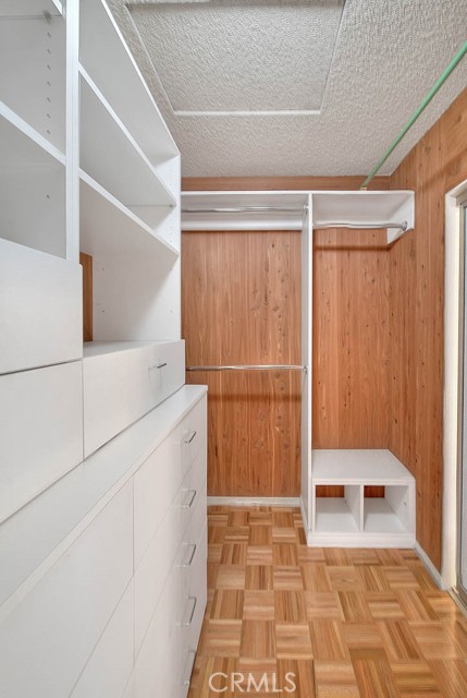 Master Closet With Cabinets Galore.  Fully Lined Cedar Walls Repels Moths.  Inlaid Wood Flooring.