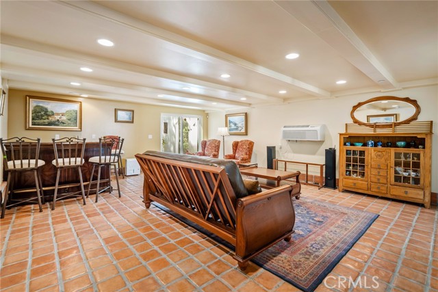 Downstairs we find the family room that offers so much versatility.  It could be turned into another primary suite or game room.