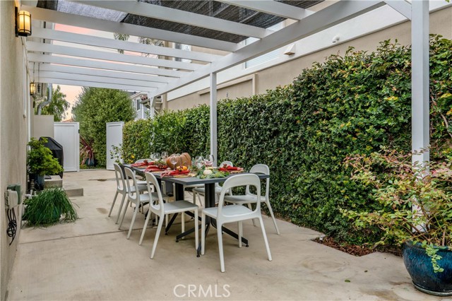 side yard patio with pergola