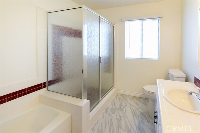 This is a shot of the same bathroom showing the new flooring.