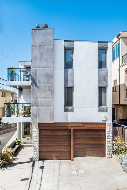 315 24th Street Manhattan Beach, California NEW Price Reduction! Fresh, contemporary design defines this dazzling listing in the Sand Section of Manhattan Beach conveniently equidistant to downtown and uptown. The property is perched high on a West facing corner lot inviting impressive, unobstructed water views and unlimited rays of light.
The extensively remodeled and well maintained exterior features a cool entrance of limestone, Ipe wood, glass and a one piece Neoporte stainless steel door.
Inside, you will find 3 spacious bedrooms, 3.5 bathrooms in approximately 2100 ‘ and 2 nicely sized, reconstructed west facing balconies.
The finishes and hardware are what you would expect for a high-end property designed with the finest: Ann Sacks tile, hand cut Italian marble from Waterworks, Fleetwood sliding glass doors and tilt-n-turn windows with sun sensored shades, Lacava and Duravit sinks, Dornbracht fixtures, oversized Sub zero refrigerator, custom stainless hood over the gorgeous Viking range, walnut floors.
The air conditioning and the five car parking are a bonus.
Jaunt the two blocks down to the ocean or just stare at it while you contemplate the sands of time.