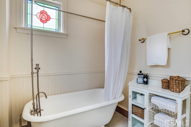 Clawfoot tub with brand new hardware in primary bedroom en-suite bathroom.