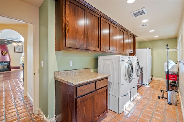 The huge laundry room has built in cabinets, folding counter and sink.  Plus there is room for additional appliances!