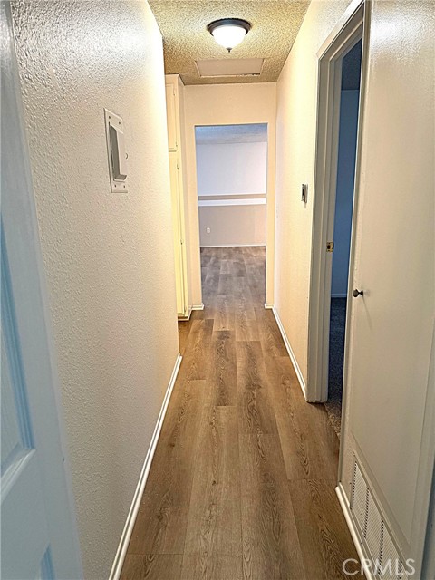 Hallway leading to bathrooms and bedrooms.