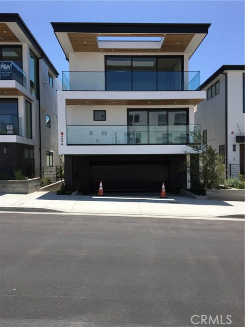 224 2nd Street Hermosa Beach, California Beautiful panoramic ocean view townhome (#2 of 3 on a Condominium plan)just steps from the beach. APN or Parcel #'s have not been assigned yet. The condominium plan has 3 units, all unattached, with 8 feet separating each unit. Each townhome is sold separately and this is #2 of all three. Being detached gives the home a feeling of being a separate house. This unit is on 2nd St., a 2-car garage, plus a driveway in front with two private parking spaces. This exquisite 2,700 sq ft townhome (BTV) has a very large roof top deck that shows off the entire ocean and is pre-plumbed for a hot tub. Beautiful outside decks on the bedroom & top floor, plus a patio off the first level, all with sand and/or white water views. Each townhome is sold separately and this is the middle. Top floor with a gourmet kitchen, equipped with a Sub-Zero, Wolf range and hood, Bosche dishwasher, sharp microwave drawer, and a beverage refrigerator. The master suite has a huge Calcutta bathroom, with a soaking tub and large walk-in closet. Extra bedrooms on each floor that can be used as a rec room or office also. Plus a large basement with a bathroom that can be used for your heart's desire: a media room. a workout room, bedroom or all of it if you choose. High Velocity heat and plumbed for High velocity air conditioning. European white oak hardwood flooring throughout the home. And blocks from restaurants and a short distance to the Hermosa Beach Pier, with the privacy of being far enough from the noise.