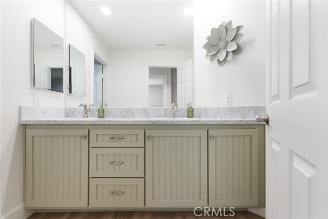 This is the 2nd hall bathroom with new cabinetry, and double sinks. This bathroom is located just off the 3rd & 4th bedroom area.