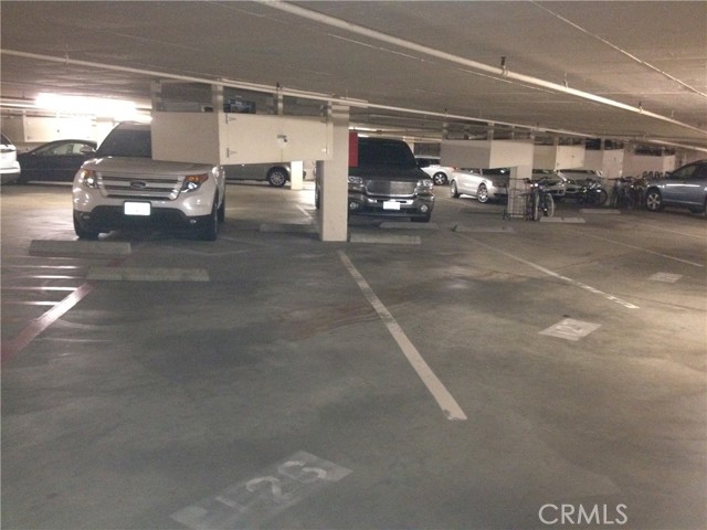 Two assigned side-by-side parking spaces with storage cabinet