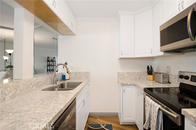 Remodeled kitchen with open bar looking into living area