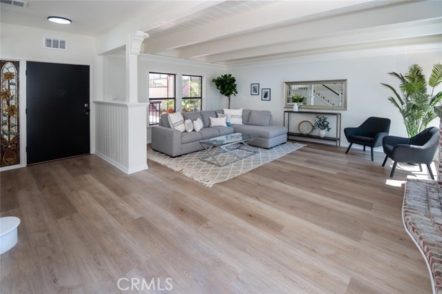 Luxury vinyl plank throughout the first level, staircase, and the upstairs hallway and bath.