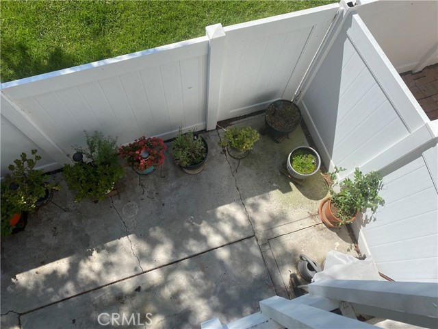 View from balcony down to back patio