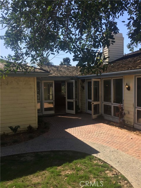 Access to rear yard and patio from kitchen and family room Access to rear yard and patio from kitchen and family room