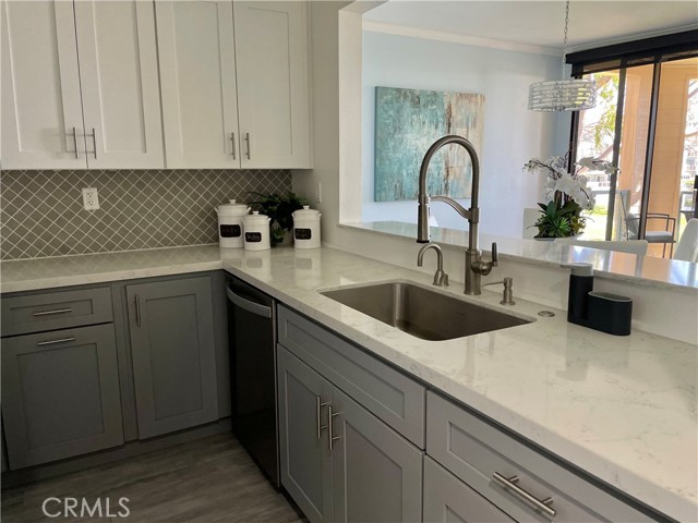 Kitchen Opens to Living and Dining Area