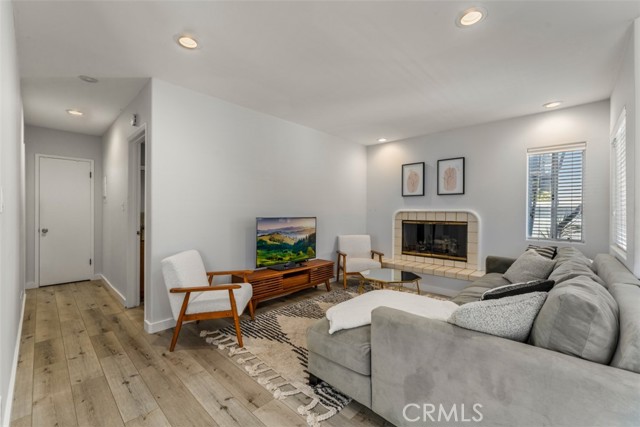 Unit 2 living room with fireplace.