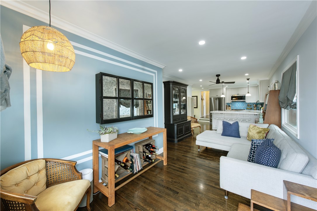 Classic coastal interior with custom paint, hardwood floors, recessed lights, natural light and a great flow