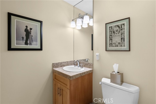 Powder room off living room, between kitchen and master across from the staircase that takes you to the loft.