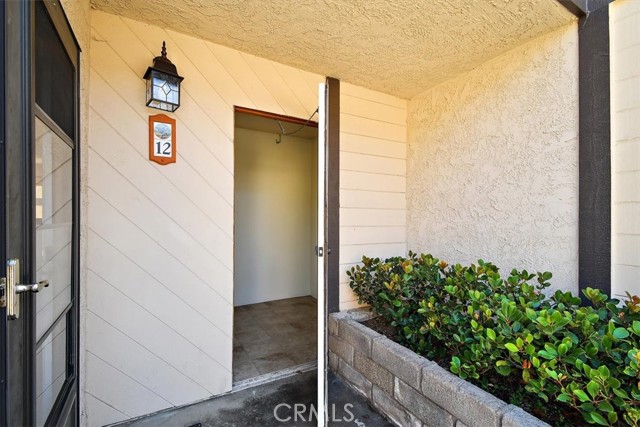Condo entrance with private storage shed