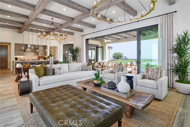 Great room opens to covered patio and views out back.