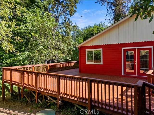 Back of apartment with large deck over looking Kelsey Creek