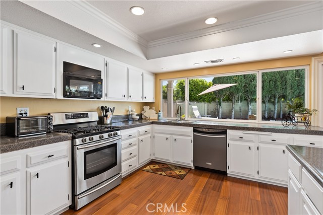 Kitchen has ample space for creating your culinary dreams. Freshly painted cabinets and updated counter tops.