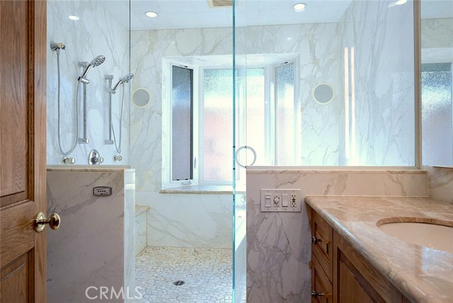 Japanese-style spa with Italian marble; Milgard bay window; dimmable LED lighting