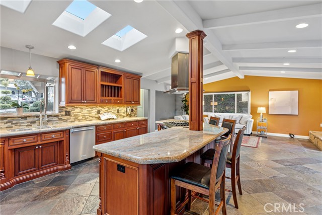 The great room is a highlight to the home with a beautifully updated entertainers kitchen featuring an expansive island that is a welcoming focal point to the home.