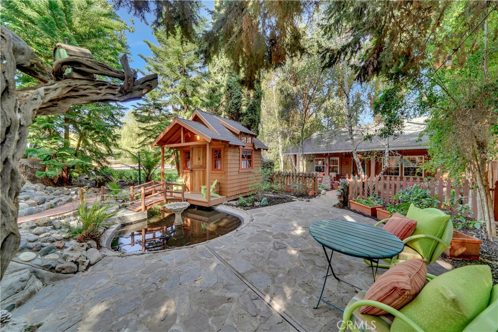 private patio adjacent to guest house and childrens play house