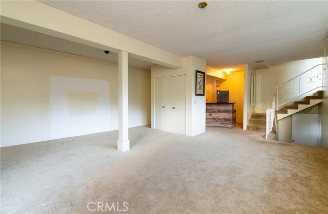 Bedroom #3: Wet bar, closet, upstairs is the kitchen and downstairs is the hallway to other bedrooms, laundry room and family room