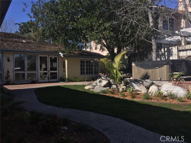 Backyard grassy area and flower bed Backyard grassy area and flower bed