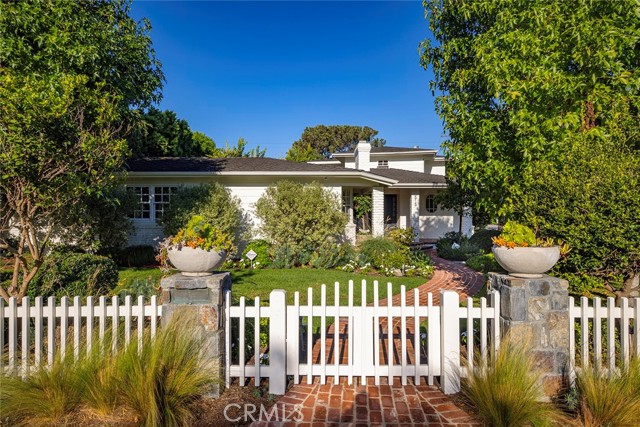 White picket fence surrounds home!