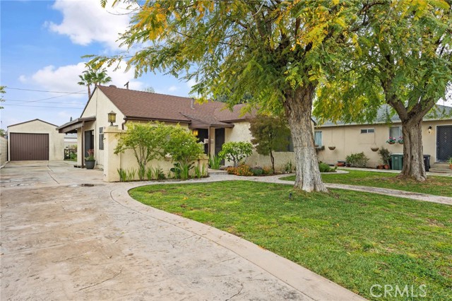 View of long driveway to house