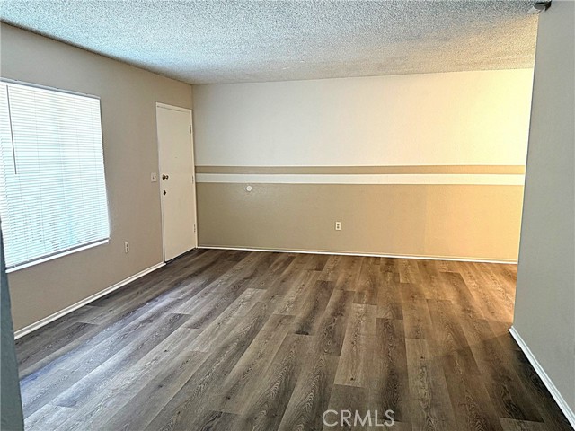Great open living space with new laminate flooring and custom paint on the walls.