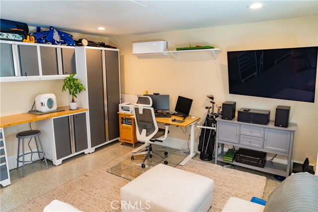 A versatile space, currently used as an office/playroom.