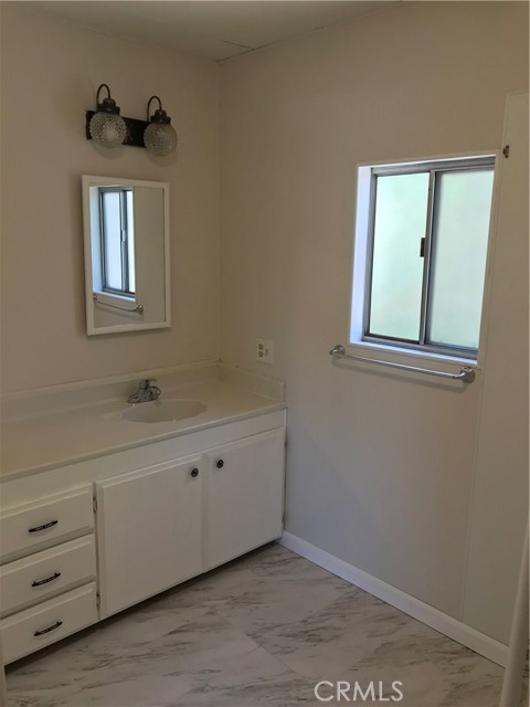 Master bathroom with soaking tub and new flooring