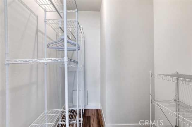 Large walk in closest with organizer racks.