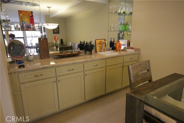 Den area features a remodeled/upgraded wet bar with granite counters!