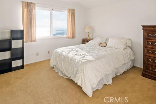 There are two spacious other bedrooms with bright windows out to the gorgeous views.