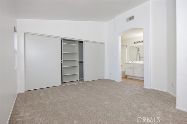 Primary bedroom suite with new carpet