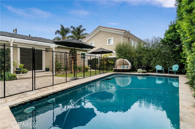 backyard pool view with safety gate