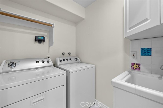 Laundry room with sink vanity