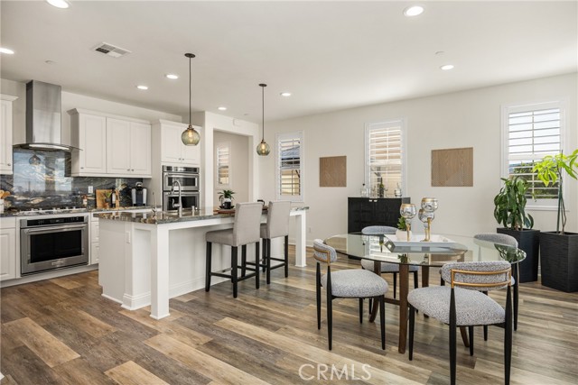 Modern Chef’s Kitchen with Quartz Countertops and Designer Lighting