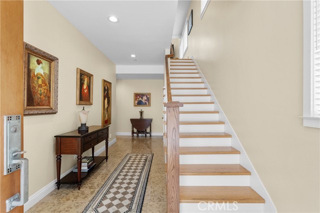 Garage door and three bedrooms to the left- Stairs go up to main living area.